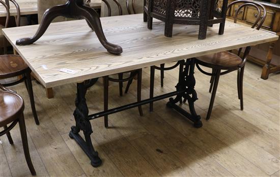 An Ash dining table with cast metal base 152 x 90cm